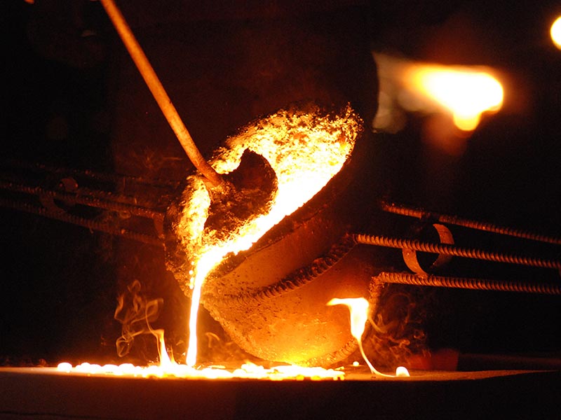 casting molten metal pouring